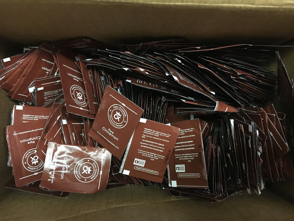 Box of Cinnamon Packets with packets spilling out